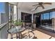 Enclosed balcony featuring tiled floors and views of the waterfront at 5640 Ferguson Ct # 2208, New Port Richey, FL 34652