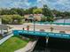 Turquoise bridge featuring benches and palm trees, providing access over the waterway to the downtown area at 5640 Ferguson Ct # 2208, New Port Richey, FL 34652