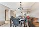 Dining area with tiled floors featuring a table with black leather chairs at 5640 Ferguson Ct # 2208, New Port Richey, FL 34652
