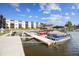 Image of a condo waterfront featuring a boat dock with several boats on a sunny day at 5640 Ferguson Ct # 2208, New Port Richey, FL 34652