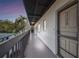 Building exterior showcasing a well-maintained walkway leading to unit 2208, enhancing curb appeal at 5640 Ferguson Ct # 2208, New Port Richey, FL 34652