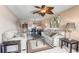 Inviting living room featuring neutral tones, comfortable sofas, and a decorative ceiling fan at 5640 Ferguson Ct # 2208, New Port Richey, FL 34652