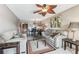 Inviting living room featuring neutral tones, comfortable sofas, and a decorative ceiling fan at 5640 Ferguson Ct # 2208, New Port Richey, FL 34652