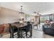 Living room with dining table and ceiling fan, and a sliding glass door to the outside at 5640 Ferguson Ct # 2208, New Port Richey, FL 34652