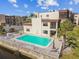 Exterior shot of a pool with lounge chairs at a waterfront condo complex on a sunny day at 5640 Ferguson Ct # 2208, New Port Richey, FL 34652