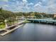Aerial view of the waterway showing dock access, bridge and waterfront businesses and downtown access at 5640 Ferguson Ct # 2208, New Port Richey, FL 34652