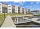 Condos with individual screened in patios along a canal, including a private boat dock at 5640 Ferguson Ct # 2208, New Port Richey, FL 34652