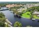 Stunning aerial of a wide riverfront with private docks, lush greenery, and waterfront access in a quiet neighborhood at 5640 Ferguson Ct # 2208, New Port Richey, FL 34652