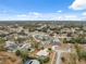 Extensive aerial view of the community with mature trees and neighborhood streets at 6112 Kinlock Ave, Spring Hill, FL 34608