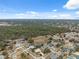 Wide aerial view of the community with mature trees and neighborhood streets at 6112 Kinlock Ave, Spring Hill, FL 34608