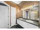 Well-appointed bathroom with dual sinks, a large mirror, and a separate shower area at 6112 Kinlock Ave, Spring Hill, FL 34608