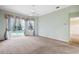 Well-lit bedroom with ceiling fan and sliding door access to the outdoor pool area at 6112 Kinlock Ave, Spring Hill, FL 34608
