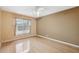 Bedroom with a ceiling fan, hardwood floors, and a window at 6112 Kinlock Ave, Spring Hill, FL 34608