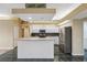 Bright kitchen with white cabinets, stainless steel appliances, and an island at 6112 Kinlock Ave, Spring Hill, FL 34608