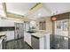 Spacious kitchen featuring stainless appliances, ample cabinet space, and an island at 6112 Kinlock Ave, Spring Hill, FL 34608