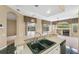 Kitchen and living room area featuring stainless steel appliances and pool views at 6112 Kinlock Ave, Spring Hill, FL 34608