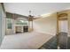 Cozy living room with a fireplace, large windows, and neutral decor at 6112 Kinlock Ave, Spring Hill, FL 34608