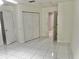 Bedroom with double door closet and access to bathroom at 6401 Drexel Dr # 1, Port Richey, FL 34668