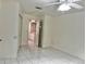 Bright bedroom with tile floors and bathroom access at 6401 Drexel Dr # 1, Port Richey, FL 34668