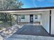 Exterior view of a single-story home with carport and landscaping at 6401 Drexel Dr # 1, Port Richey, FL 34668