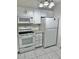 White kitchen appliances and cabinets in this home at 6401 Drexel Dr # 1, Port Richey, FL 34668
