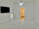 Spacious living room with tile floors and a ceiling fan at 6401 Drexel Dr # 1, Port Richey, FL 34668