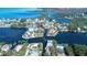 Breathtaking aerial view of canal-front homes and waterfront community with direct access to the bay at 6801 Nowiki Ave, Hudson, FL 34667