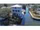 Aerial view of a waterfront property with a private dock at 6801 Nowiki Ave, Hudson, FL 34667