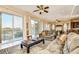 Spacious living room with large sliding doors opening to a balcony and water views at 6801 Nowiki Ave, Hudson, FL 34667