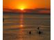 Gorgeous sunset scenery with silhouetted kayakers enjoying the calm, reflective waters at dusk at 6801 Nowiki Ave, Hudson, FL 34667