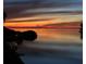 Scenic sunset casting vibrant colors over the calm waters, creating a serene and picturesque view at 6801 Nowiki Ave, Hudson, FL 34667