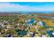 An aerial view of the community showcasing its waterfront location near winding rivers and marshlands at 7256 Westwind St, Weeki Wachee, FL 34607