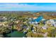 Stunning aerial view of waterfront home, beautiful landscaping, and access to Weeki Wachee River at 7256 Westwind St, Weeki Wachee, FL 34607