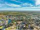 Expansive aerial shot of the Weeki Wachee area with the home nestled among the trees near the water at 7256 Westwind St, Weeki Wachee, FL 34607