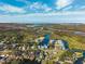An aerial view of the community with a river that meanders through marshland towards the ocean at 7256 Westwind St, Weeki Wachee, FL 34607