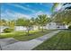 Spacious backyard with lush green grass and manicured landscaping at 7256 Westwind St, Weeki Wachee, FL 34607