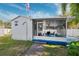 A cozy screened porch area perfect for relaxation at 7256 Westwind St, Weeki Wachee, FL 34607