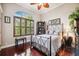 This bedroom has a large window with shutters at 7256 Westwind St, Weeki Wachee, FL 34607