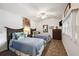 The well-lit bedroom features two beds, a ceiling fan, and a dresser at 7256 Westwind St, Weeki Wachee, FL 34607