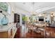 Dining room featuring hardwood floors, chandelier, and sliding glass doors to the patio at 7256 Westwind St, Weeki Wachee, FL 34607