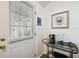 A well-lit entryway with a coffee cart and crab artwork at 7256 Westwind St, Weeki Wachee, FL 34607