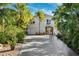 Beautiful two story-home with lush tropical landscaping at 7256 Westwind St, Weeki Wachee, FL 34607