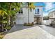 Lovely two-story home featuring a garage, balcony, and an airy drive-through undercroft at 7256 Westwind St, Weeki Wachee, FL 34607