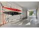 A well-lit carport with mounted kayaks and a surfboard, offering convenient storage for water sports equipment at 7256 Westwind St, Weeki Wachee, FL 34607
