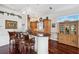 Kitchen featuring barstool seating, dark granite countertops and hardwood flooring at 7256 Westwind St, Weeki Wachee, FL 34607