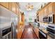 Spacious kitchen with stainless steel appliances and hardwood floors at 7256 Westwind St, Weeki Wachee, FL 34607