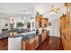 Bright gourmet kitchen with stainless appliances, granite countertops, and hardwood floors at 7256 Westwind St, Weeki Wachee, FL 34607