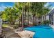 Lush, tropical landscaping around the home, enhancing its curb appeal at 7256 Westwind St, Weeki Wachee, FL 34607