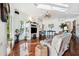 Cozy living room featuring dark hardwood floors, a fireplace, and great natural light at 7256 Westwind St, Weeki Wachee, FL 34607