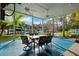 Large waterfront patio with ceiling fans, outdoor furniture, and views of the boat dock at 7256 Westwind St, Weeki Wachee, FL 34607